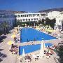 Spacious pool surrounded by hotel